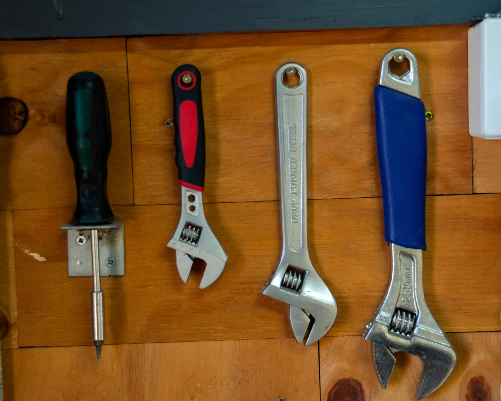 Workshop tools arranged on a wooden wall
